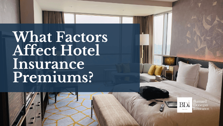 Hotel room interior with bed, decorative pillows, and modern furnishings, featuring overlay text "What Factors Affect Hotel Insurance Premiums?" and Barnard Donegan Insurance logo, emphasizing hotel insurance insights.